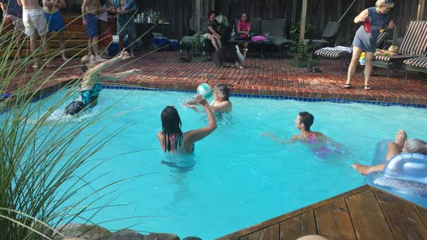 Nordic Ski Racers playing volleyball in the pool