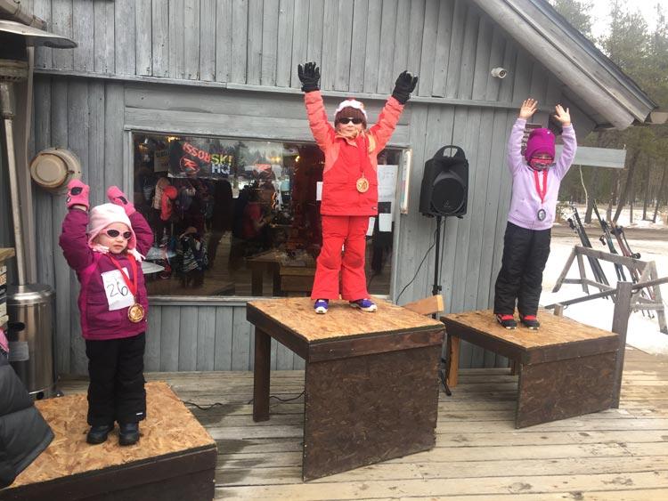 Three kids on the podium at the 2021 Muffin Race cross country ski race