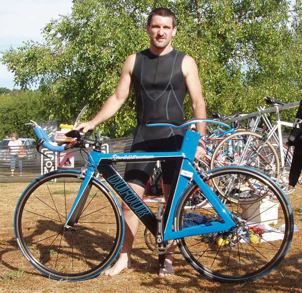 Yvon with his hand-built carbon framed triathlon bike