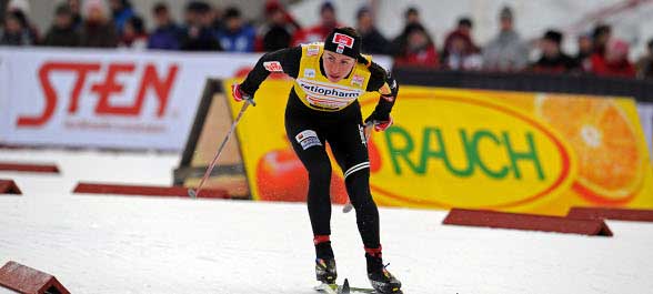 Justyna Kowalczyk claimed victory in the classical 15 km Mass start