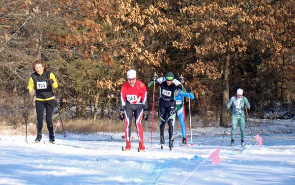Dan Yankus (black suit) laps four skiers as he powers his way to his second victory of the weekend