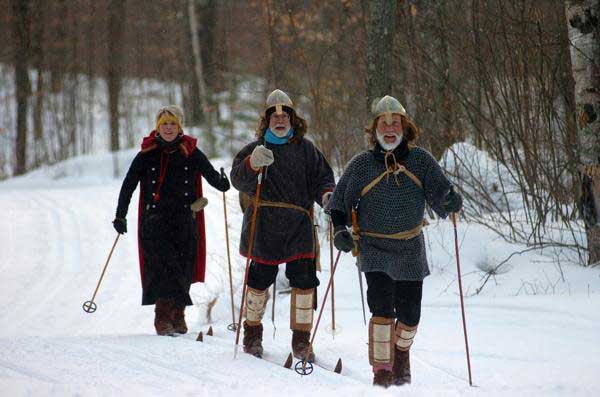 Three cross country skiers depict the two Birkebeiner Warriors and Inga, the mother of baby Prince Haakon, at the annual American Birkebeiner ski race