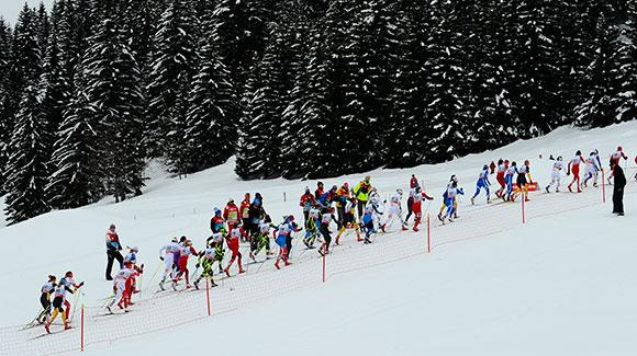 Skiers charge up a hill in the women's 10k mass start in La Clusaz. (Getty Images/Agence Zoom-Alain Grosclaude)