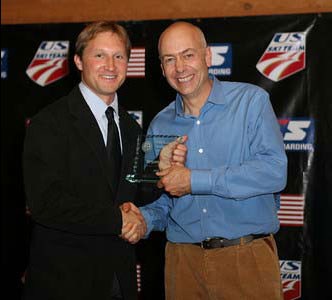 USSA Development Coach of the Year Bryan Fish receives his award from USSA Chairman of the Board, Dexter Paine (credit: Scott Sine)