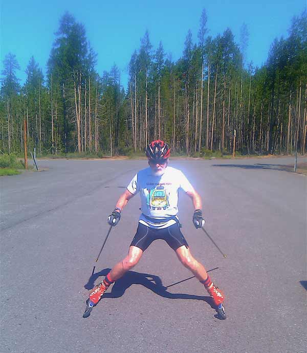 Bert showing how to snowplow on rollerskis