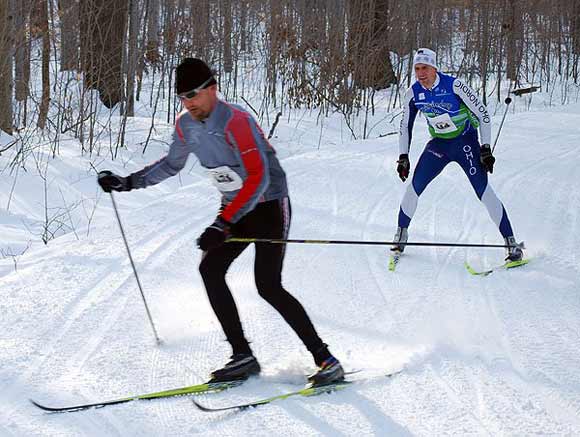 Jim Samuels leads Michael Schaefer around a fast corner in the Nordic Flurry 5k Classic ski race