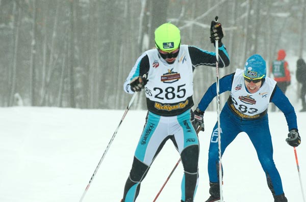 Caitlin Gregg (Team Gregg) and Rosie Brennan (APU) battle the cold and blowing conditions at the U.S. Cross Country Championships.
