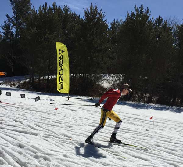 Jared Craigg sprinting on his cross coutnry sktate skis