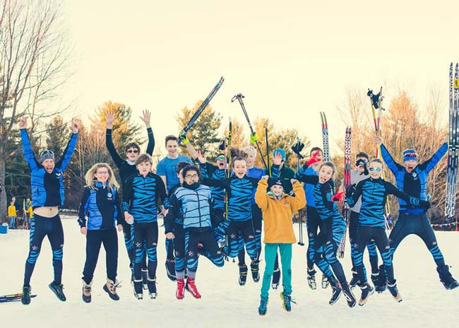 Copper Country Ski Tigers celebrate vctory in Michigan HS XC Ski Championships