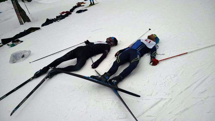 cross country ski racers collapse at the finish of the Michigan Cup Freestyle Championships