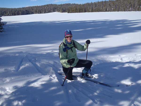 1-28 Yellowstone 523 After Charlotte removed her right ski, she sunk above her knee at lunch at frozen Wrangler Lake