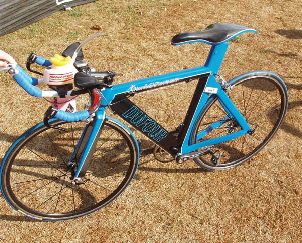 Yvon with his hand-built carbon framed triathlon bike