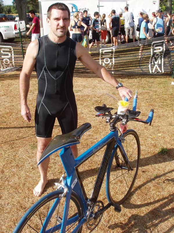 Yvon with his hand-built carbon framed triathlon bike