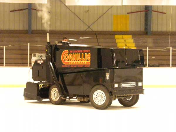 Using the Zamboni to cut ice into snow for the cross country ski course