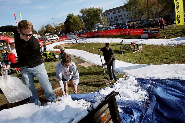 Edging the cross country ski course tarps to unload snow