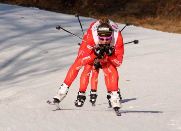 essie Diggins coming into the finish straight with Jennie Bender and Caitlin Gregg tucked in behind her