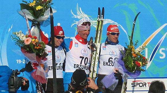 	 Noah Hoffman stands proudly on the medals stand winning silver in the men's 15k U23 World Championships.