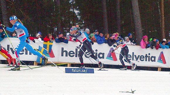 	 Jessie Diggins chases Kikkan Randall during the women's 10k mass start in Falun. (USSA-Margo Christiansen)