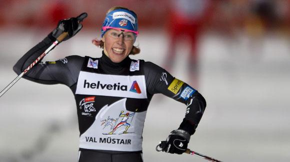 Kikkan Randall pumps the sky as she coasts to a second Tour de Ski stage win in three races. (Getty Images/AFP-Fabrice Coffrini)