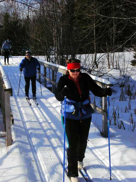 Cross country skiing over a wildernes bridge
