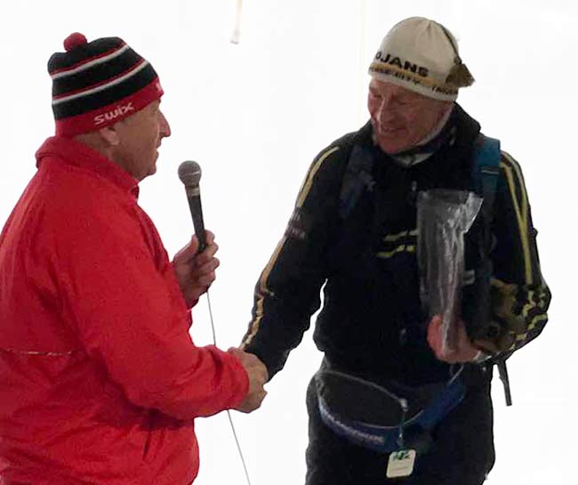 Ernie Brumbaugh awarding plaque to John Kostrzewa