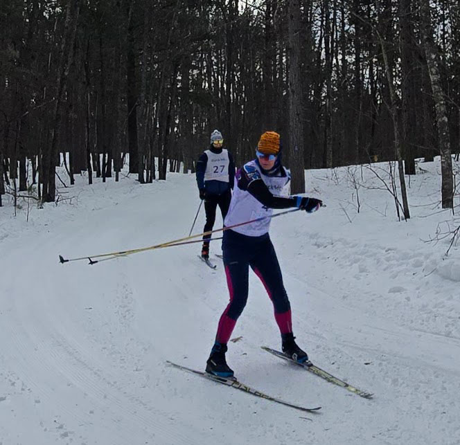 Sarah Newmister makes it happen, despite her poles locking behind her