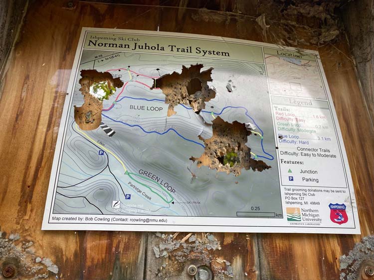 Trail head sign was shot up at Suicide Bowl