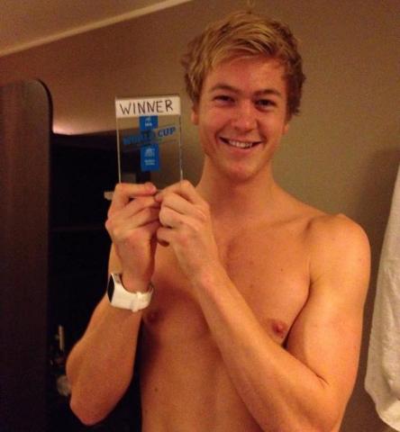 Erik Bjorsen holds a team-made award for skiing the fastest second-leg time. (Liz Stephen)
