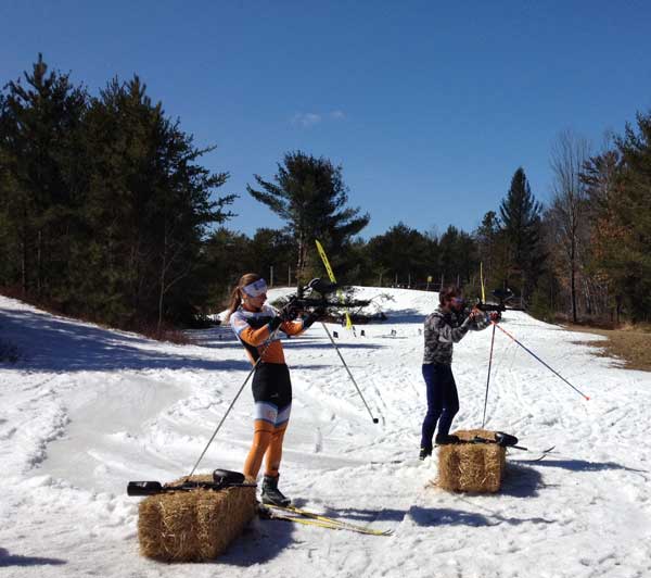 Kaitlyn Patterson and Dave Borton shooting during the Paintball biathlon