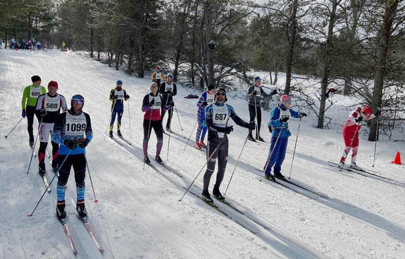 Wave of skiers getting ready to start