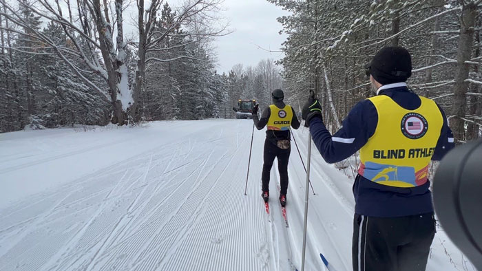 Jim guiding John on cross country ski trail