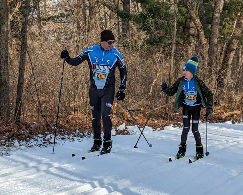Adam and Beckham ski racing