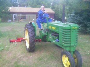 Mario Kennedy mowing the cross country ski trails with my 1940 John Deere