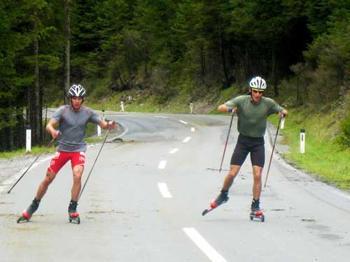 Billy Demong and Taylor Fletcher race up the hill side-by-side